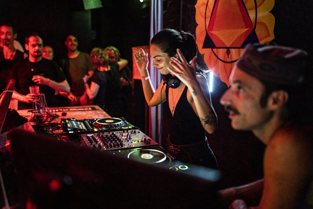 Chilean DJ B.Clarke, creating energetic rhythms for all-night dancing.